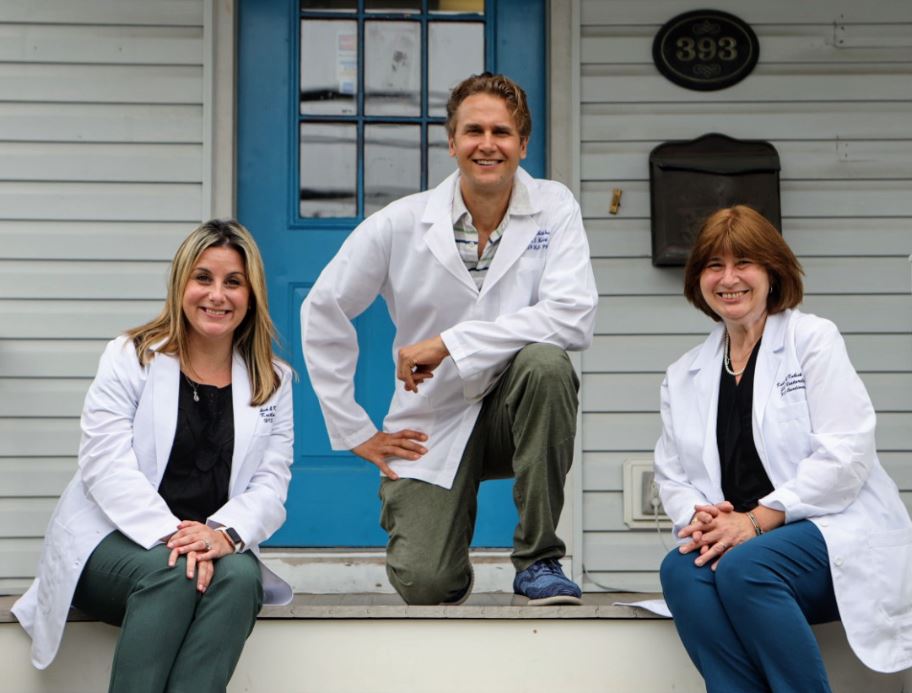 The Kubick & Kubick team posing on the office front porch